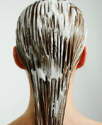 Applying Ultra-Moisturizing Natural Conditioner for soft, manageable hair